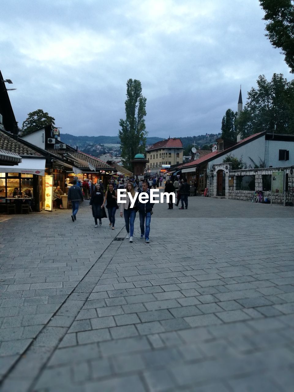 PEOPLE WALKING ON ROAD