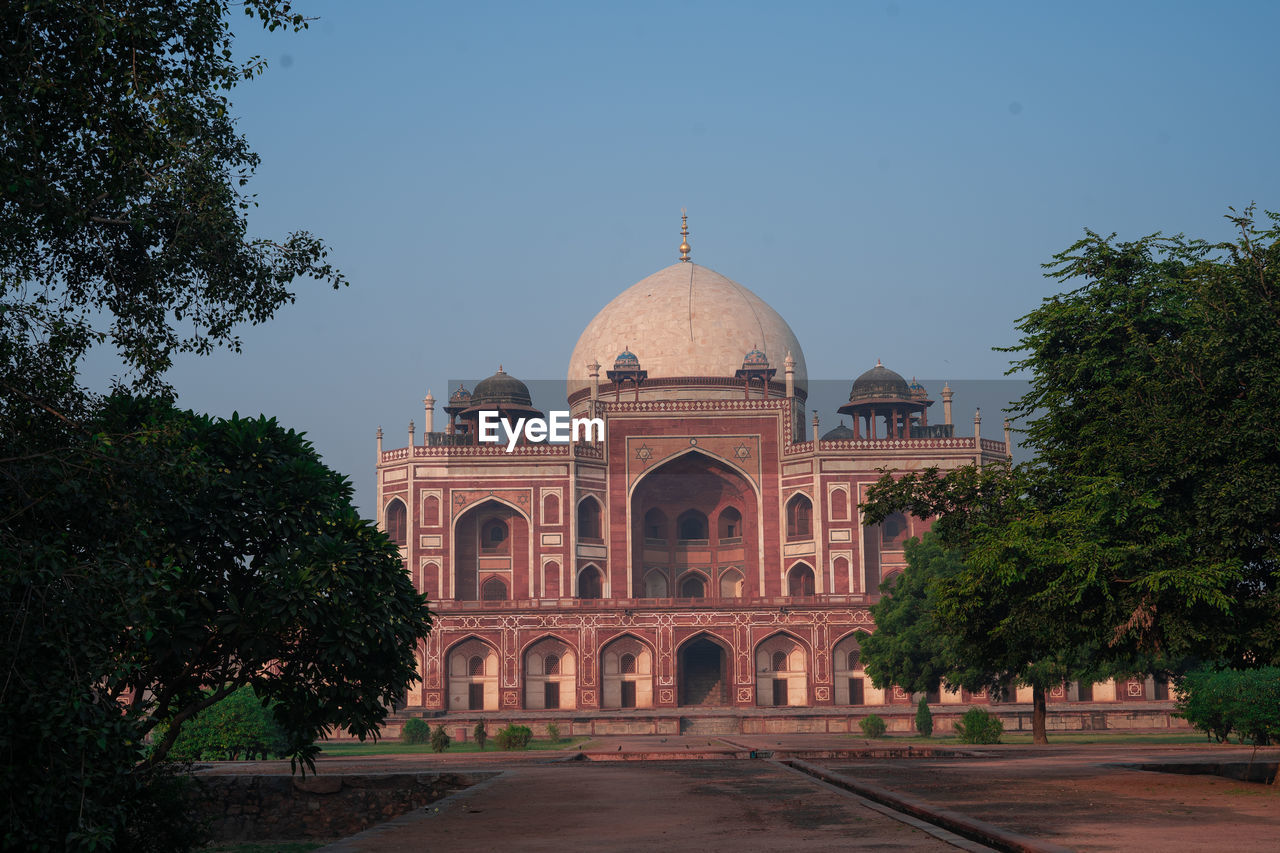 Beautiful humayun tomb with trees in foreground