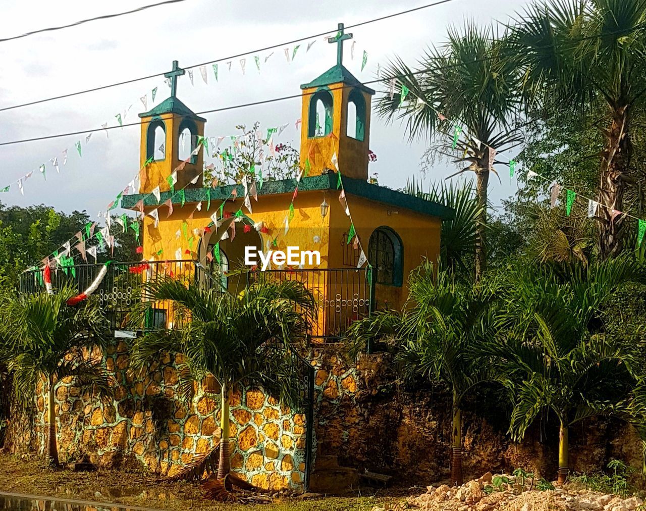 LOW ANGLE VIEW OF TEMPLE HANGING FROM BUILDING