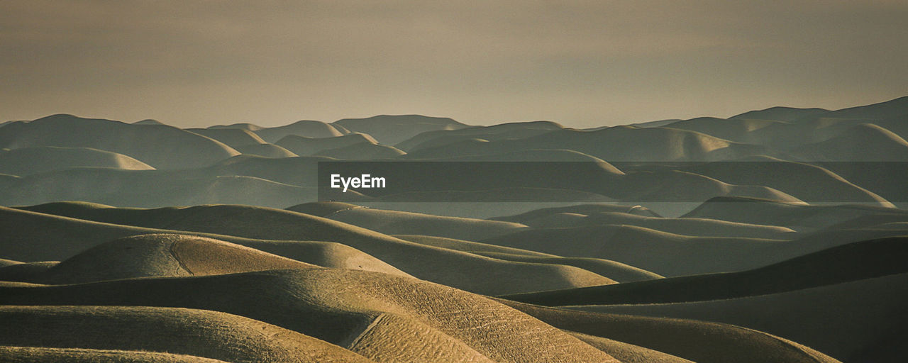 Scenic view of desert against sky