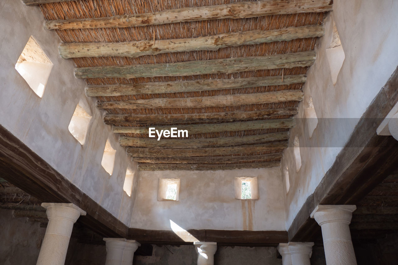 LOW ANGLE VIEW OF AN ABANDONED BUILDING