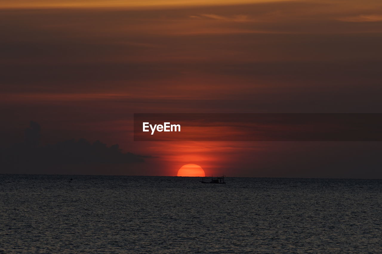 SCENIC VIEW OF SEA DURING SUNSET