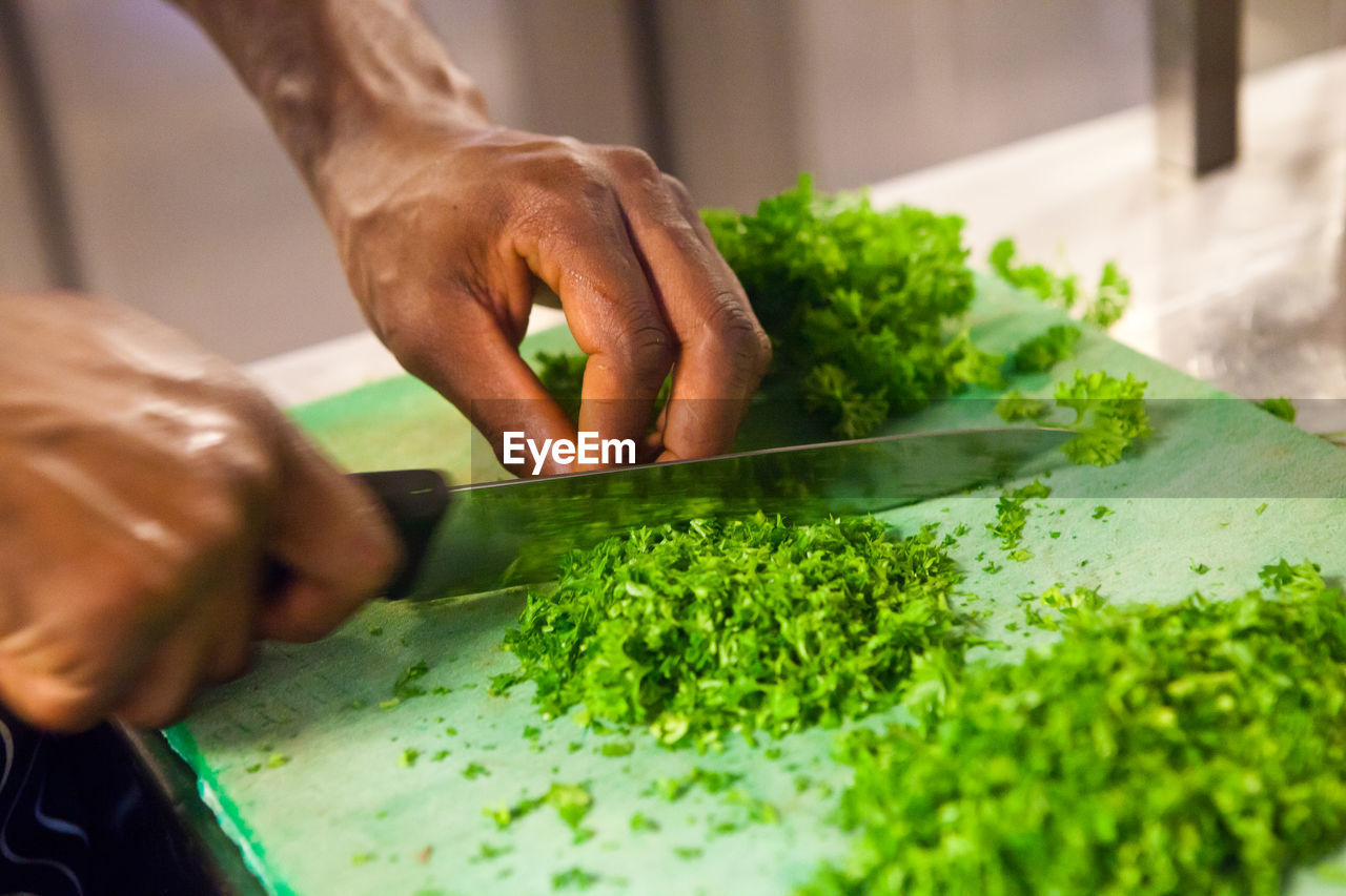 Close-up of man preparing food in kitchen