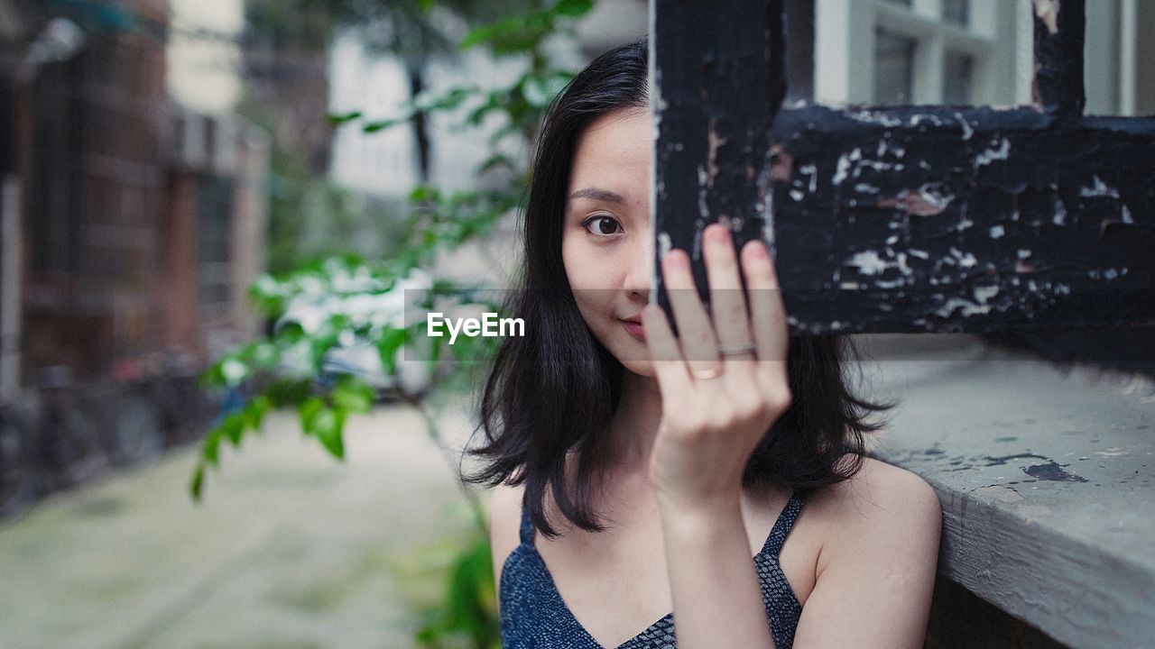 CLOSE-UP PORTRAIT OF YOUNG WOMAN WITH EYES CLOSED