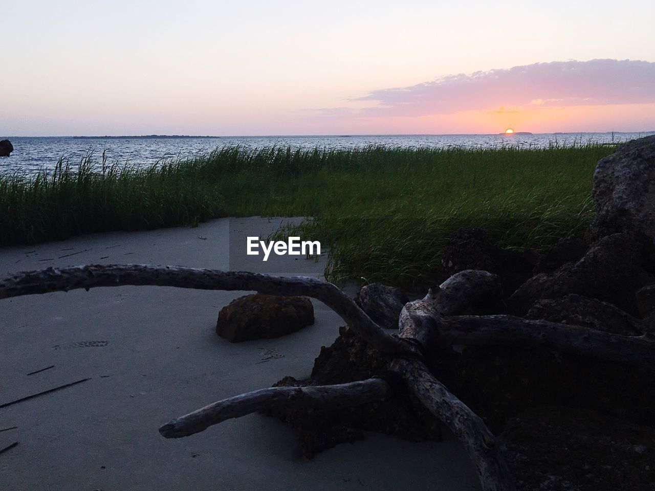 SCENIC VIEW OF SEA DURING SUNSET