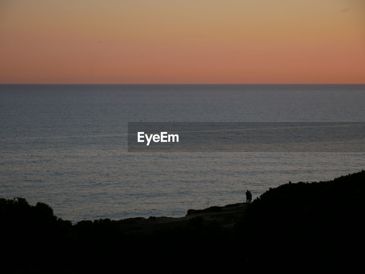 SCENIC VIEW OF SEA DURING SUNSET