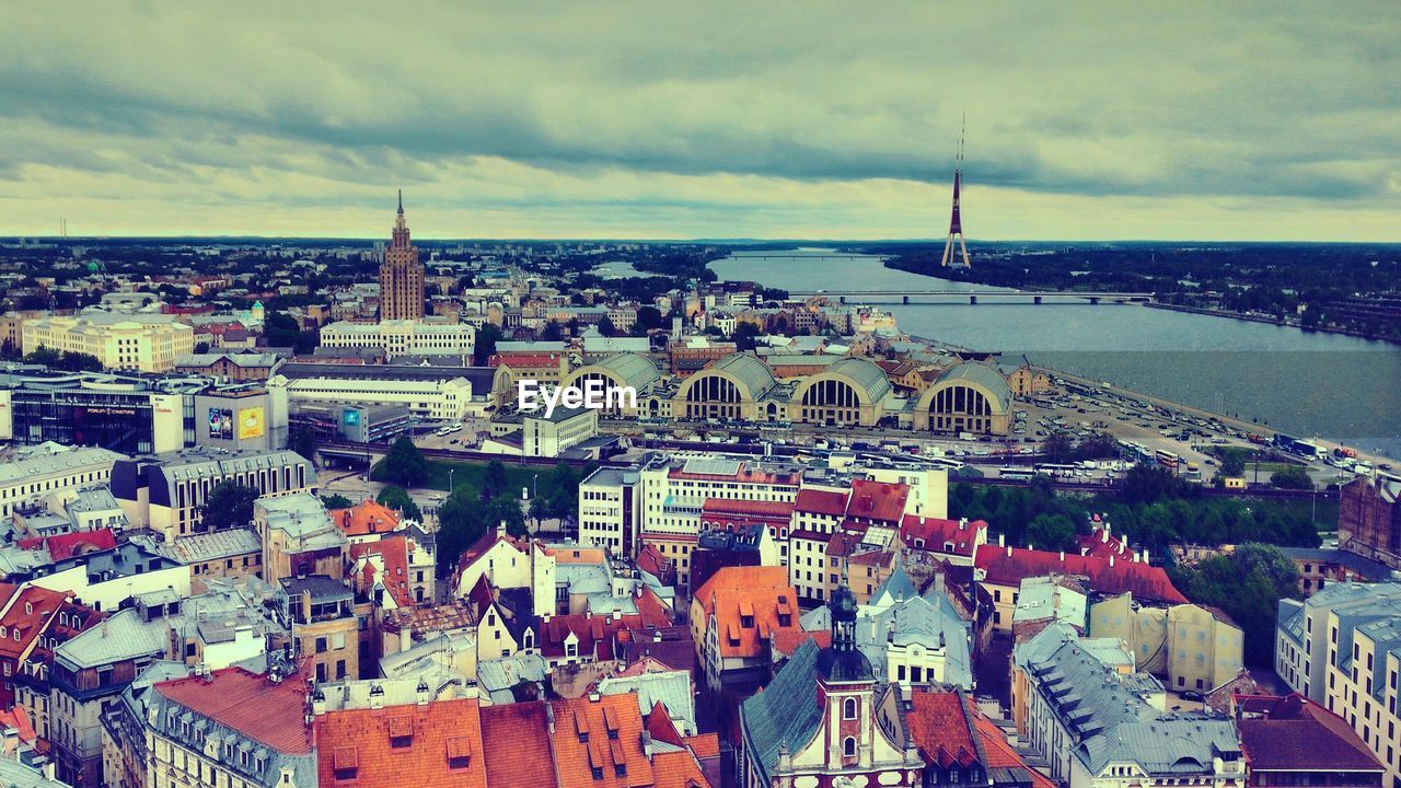 High angle view of city against cloudy sky