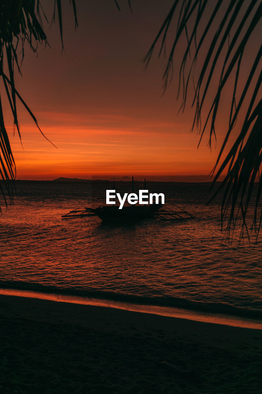 Sailboat sunset silhouette