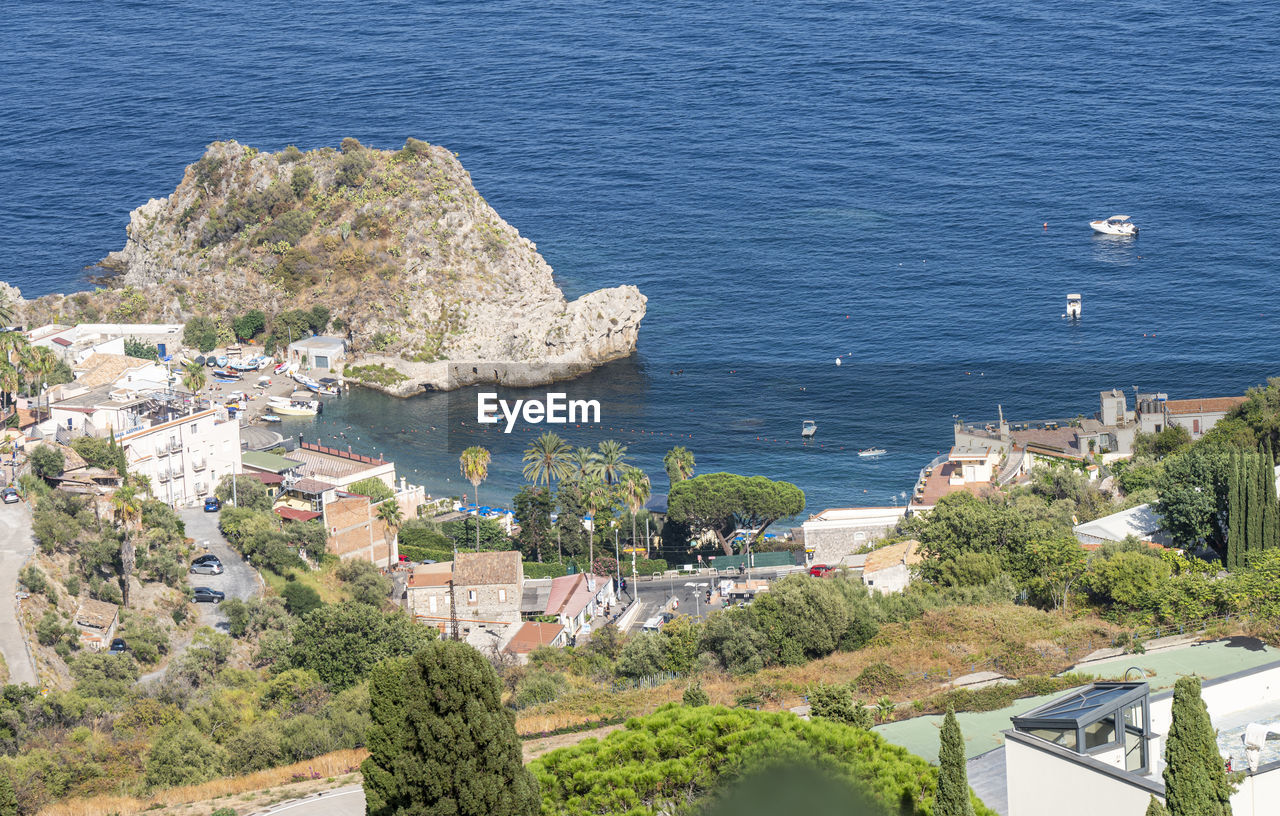 High angle view of townscape by sea