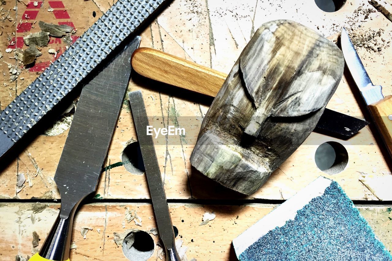 Close-up of work tools on wooden surface