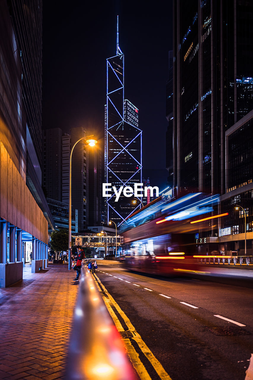 Illuminated city street at night