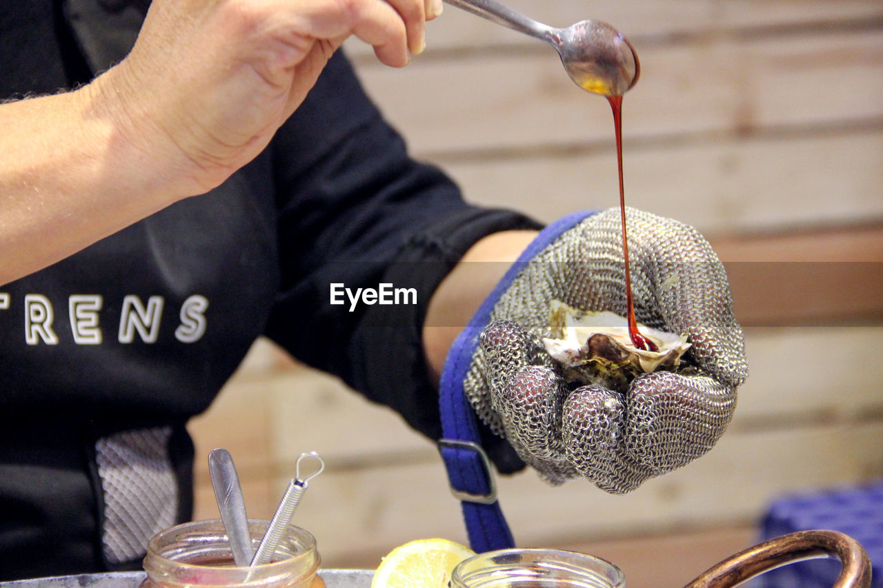 Close-up of man holding making food