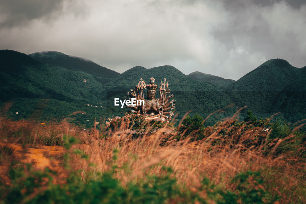 Panoramic view of land and mountains against sky