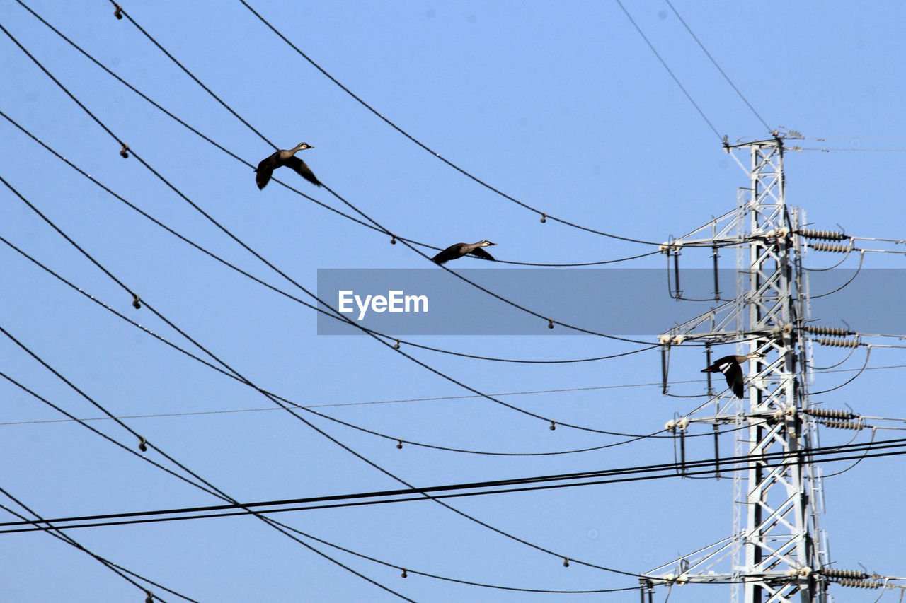 low angle view of electricity pylon against sky