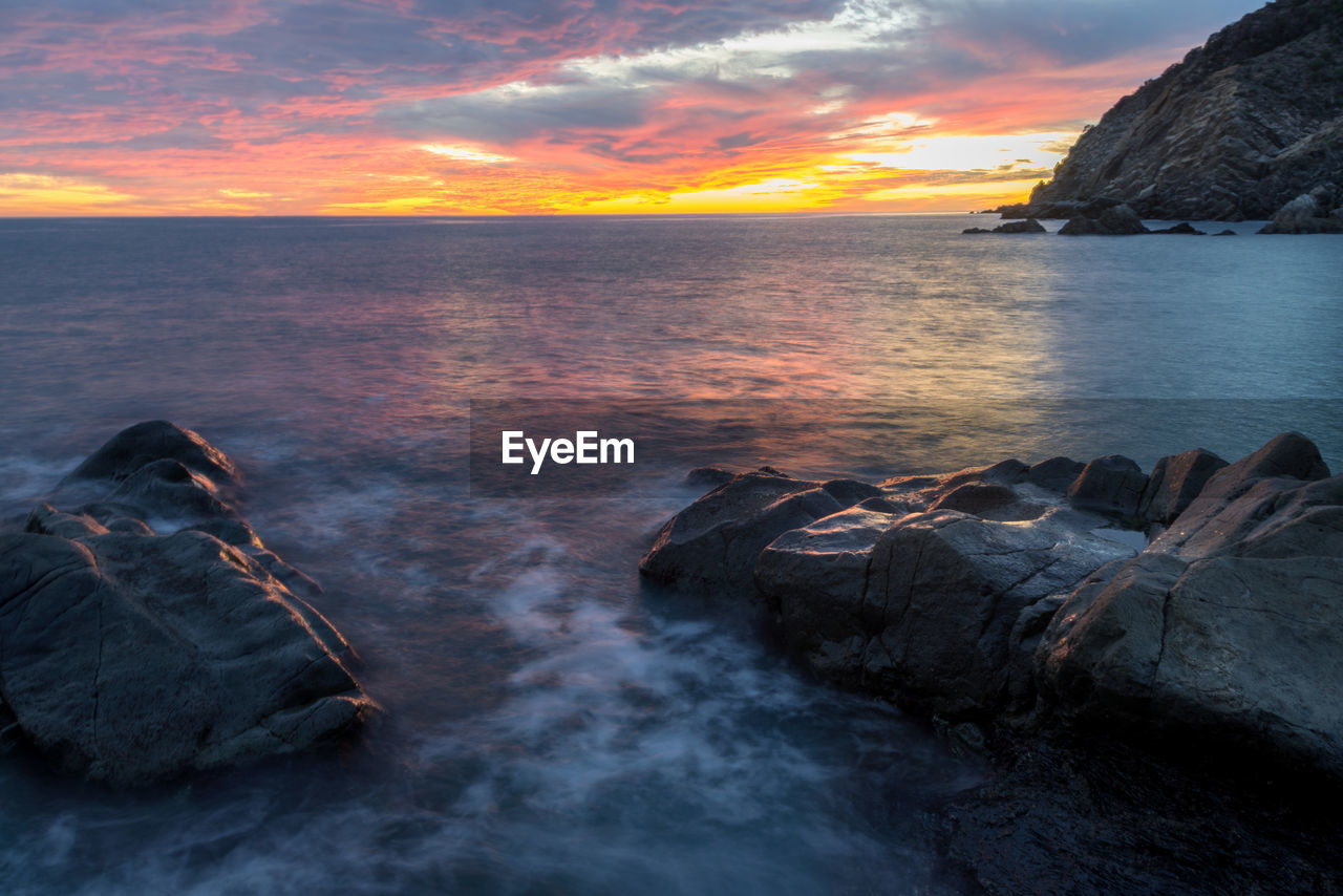 Scenic view of sea against sky during sunset