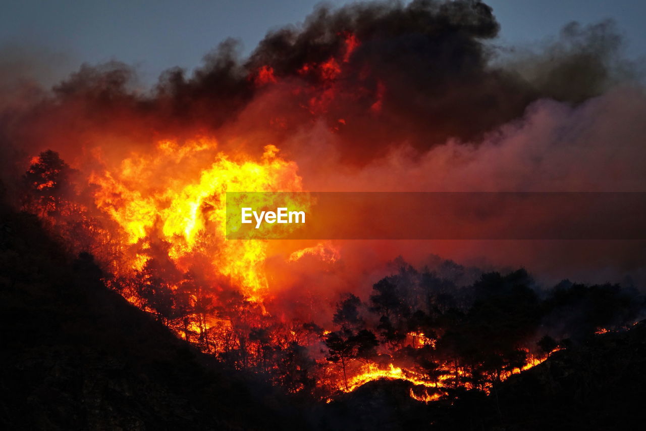 Fire against sky at night