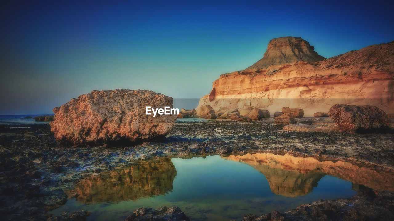 ROCK FORMATION AGAINST SKY