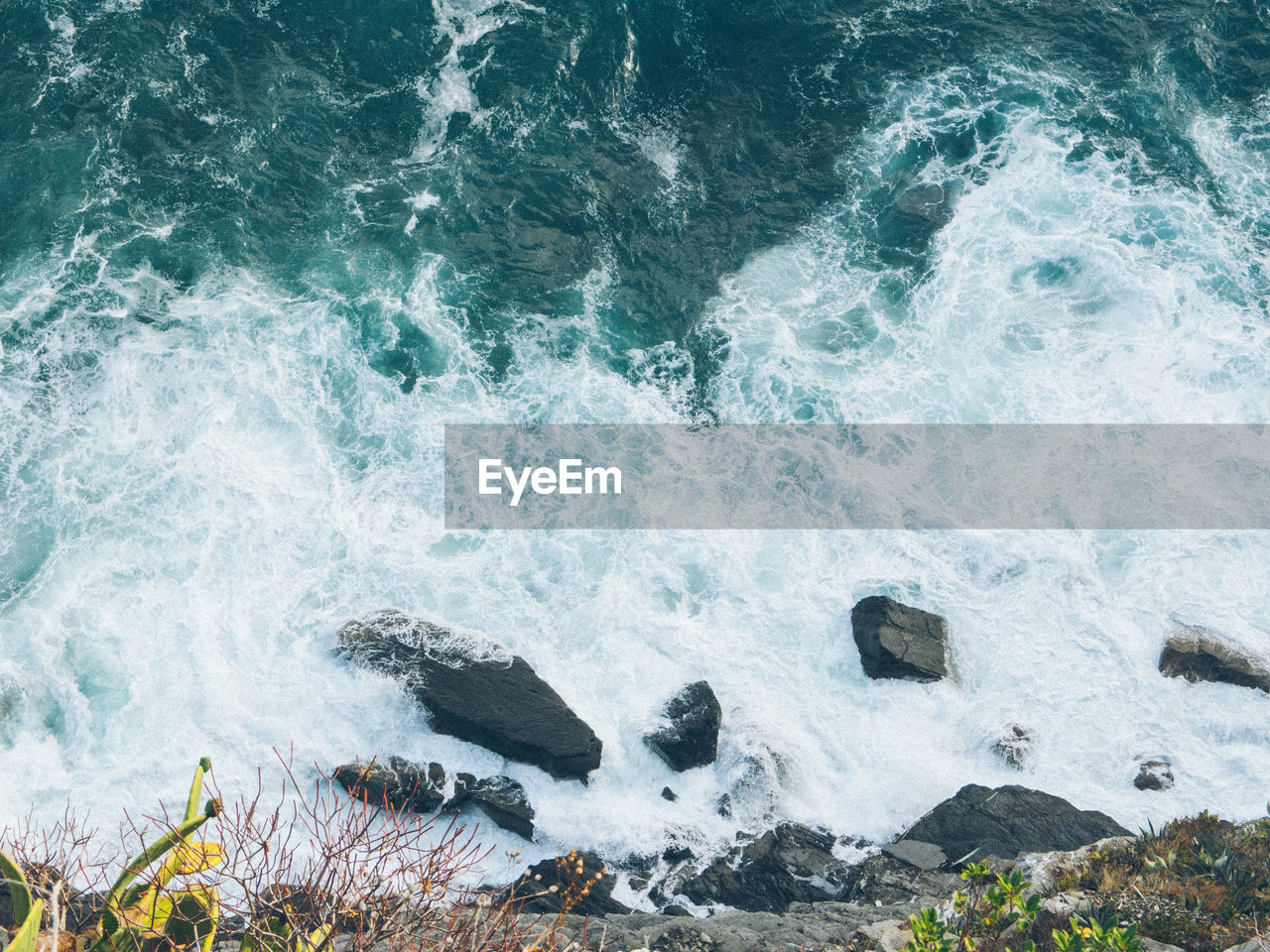 WAVES SPLASHING ON ROCKS