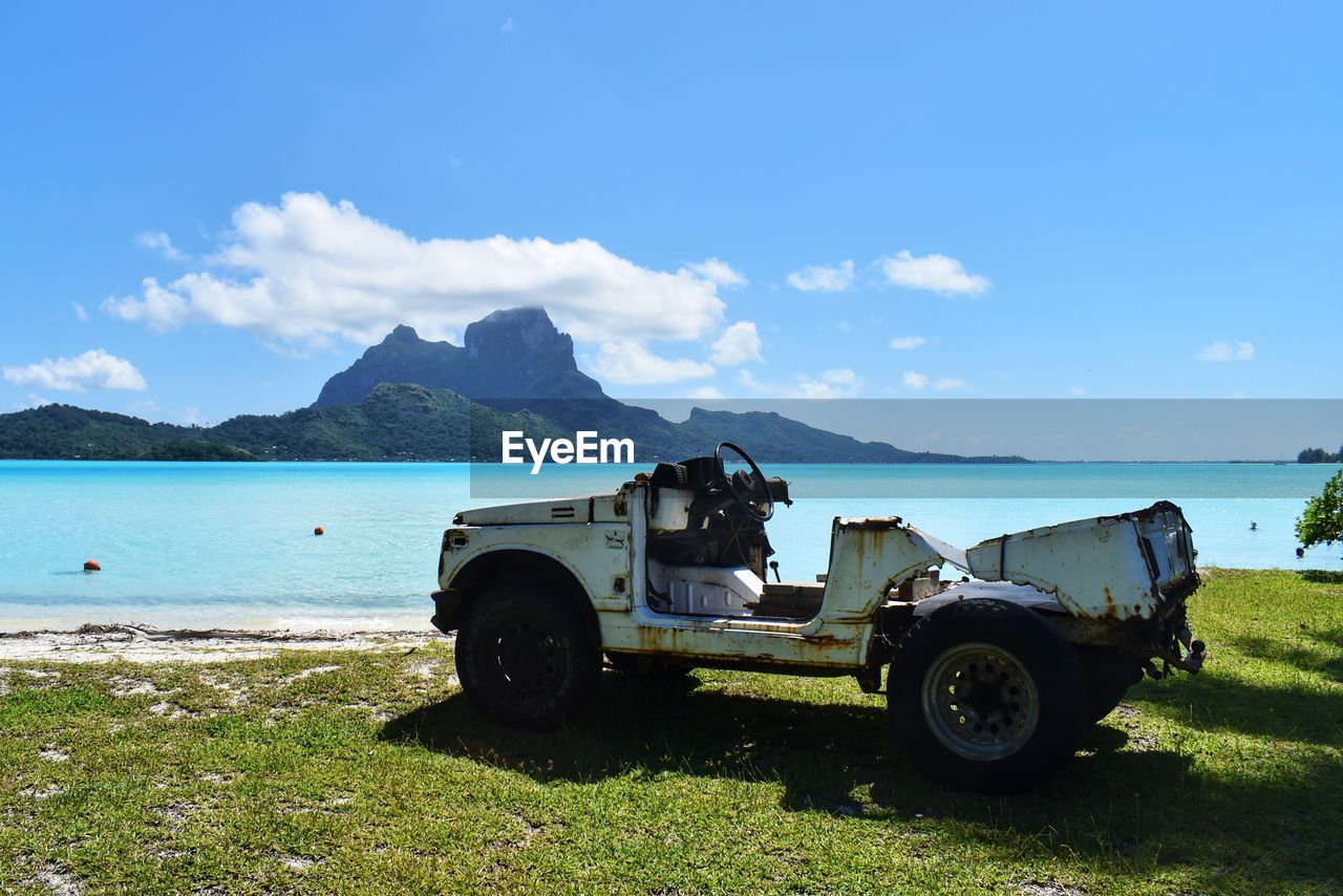 VINTAGE CAR ON BEACH