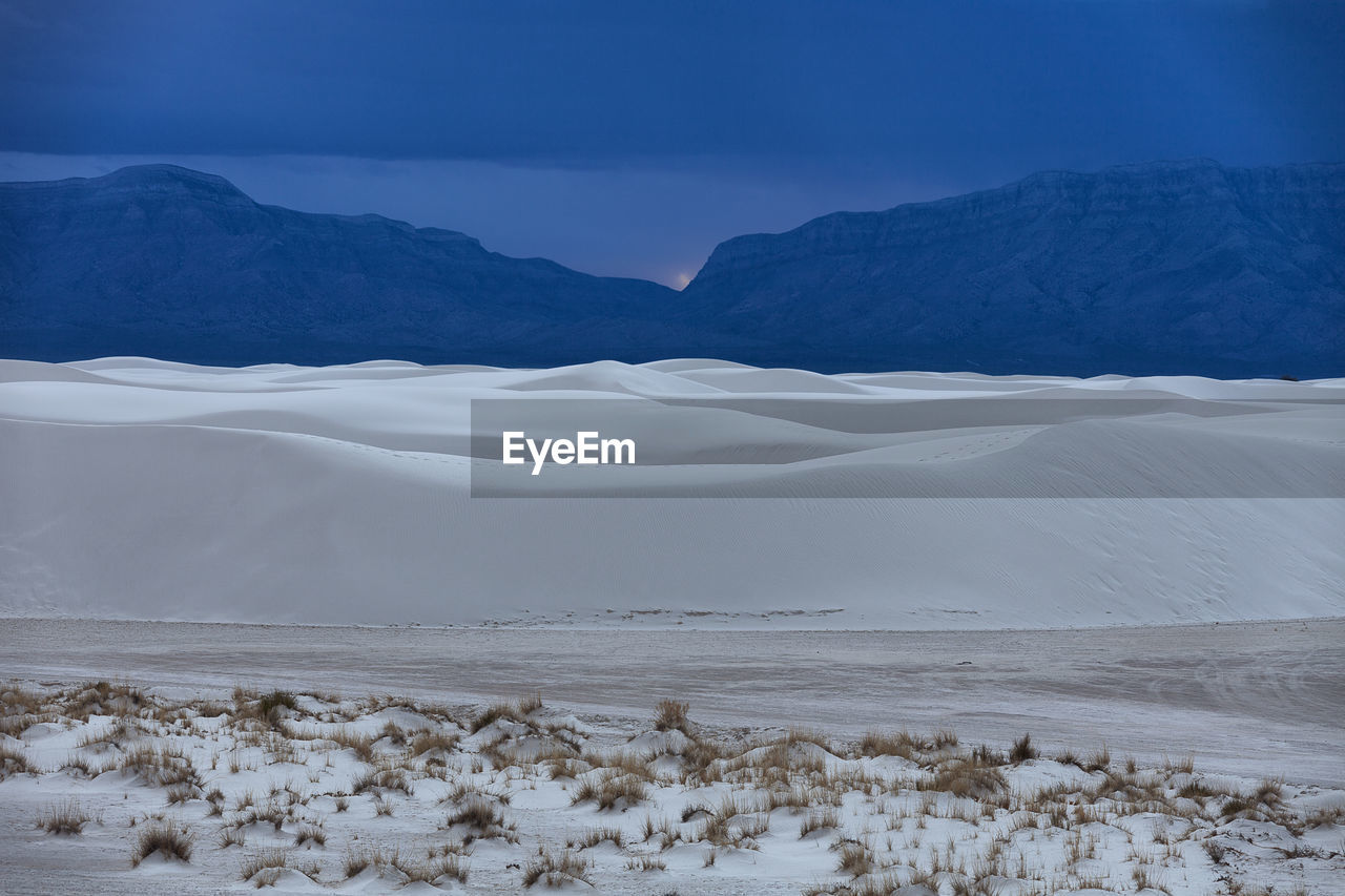 Idyllic shot of white sands national monument against sky during sunset