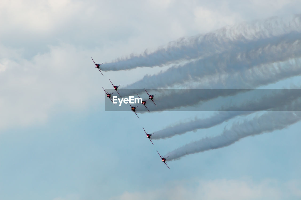 LOW ANGLE VIEW OF HELICOPTER FLYING AGAINST SKY