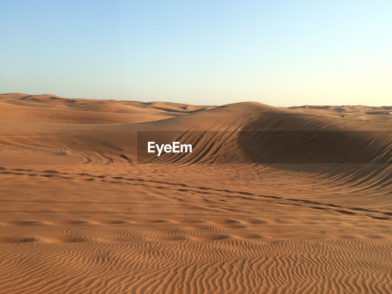 Scenic view of desert against clear sky