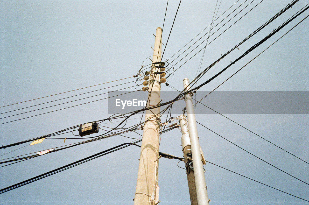 low angle view of electricity pylon against sky