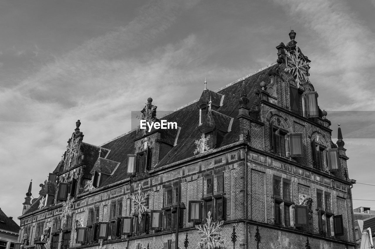 architecture, building exterior, built structure, sky, black and white, history, the past, building, low angle view, cloud, monochrome, monochrome photography, city, nature, landmark, travel destinations, cityscape, house, no people, old, travel, outdoors, day, window, urban area