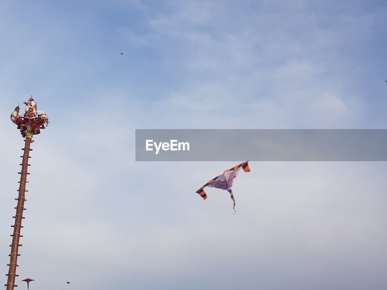 Low angle view of kite flying in sky