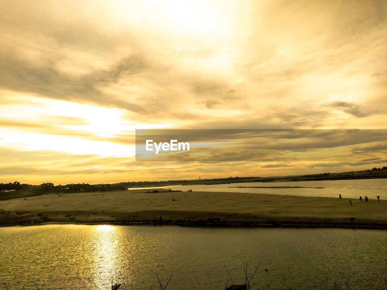 Scenic view of lake against sky during sunset