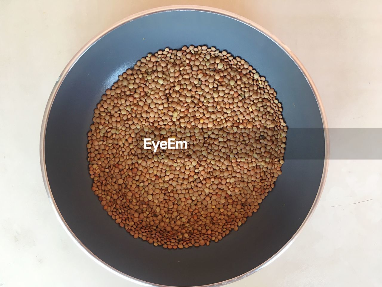 Directly above shot of legumes in bowl on table