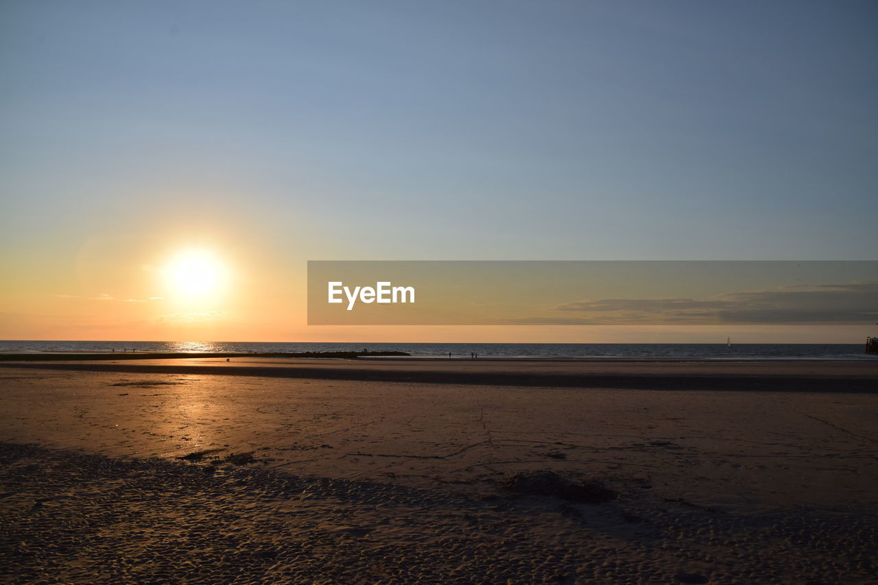 SCENIC VIEW OF SEA AT SUNSET