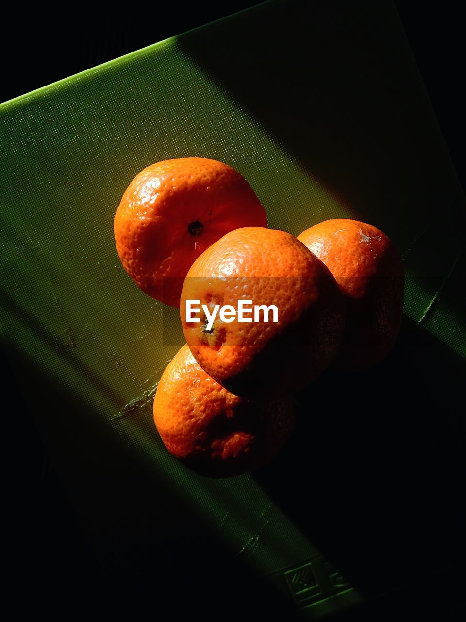 High angle view of tangerines on table