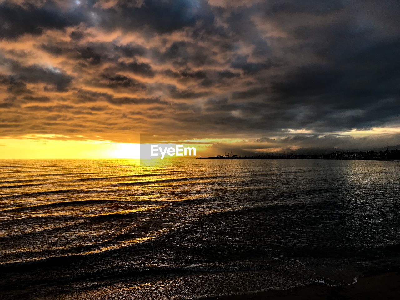 Scenic view of sea against sky during sunset