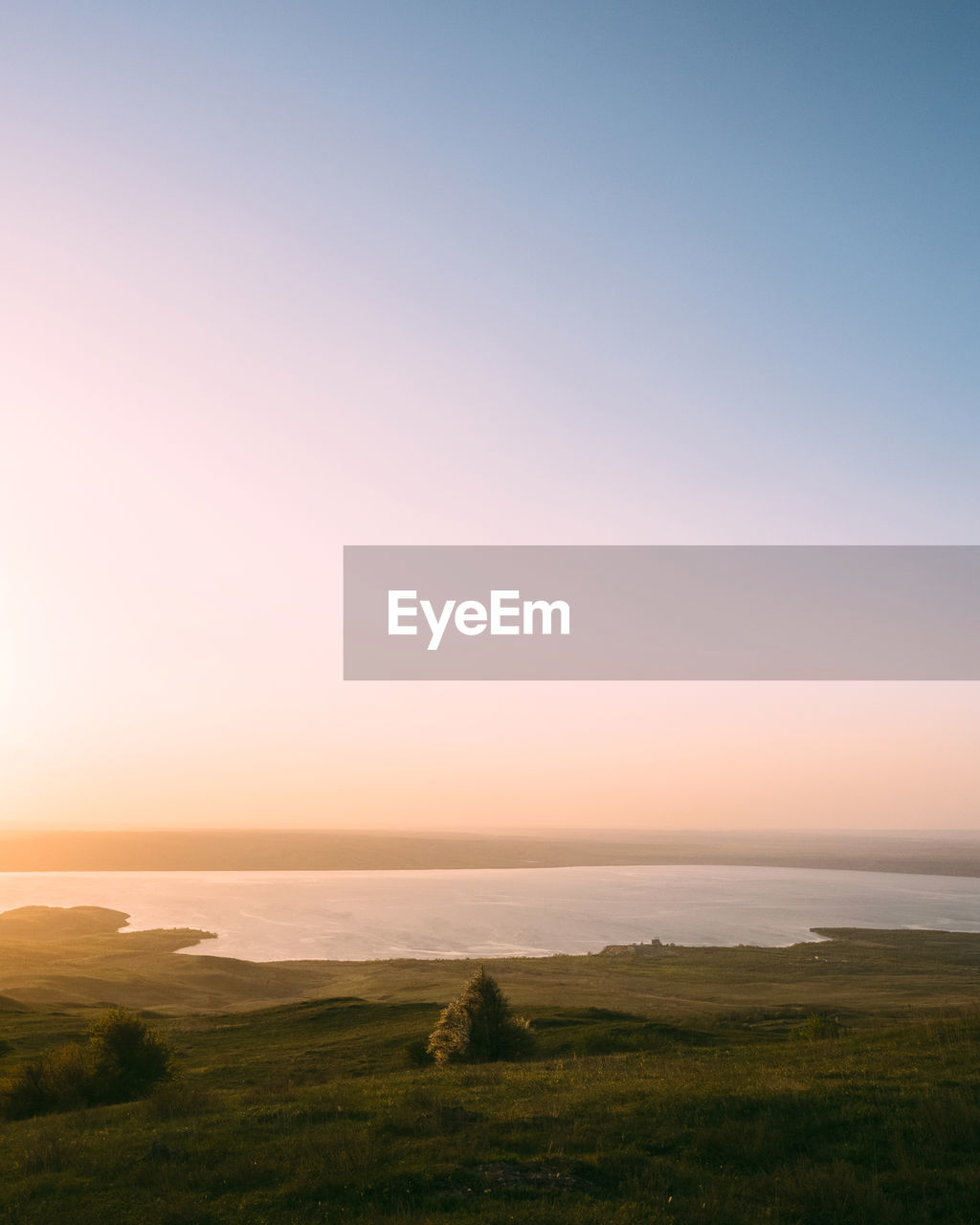 Scenic view of sea against clear sky during sunset