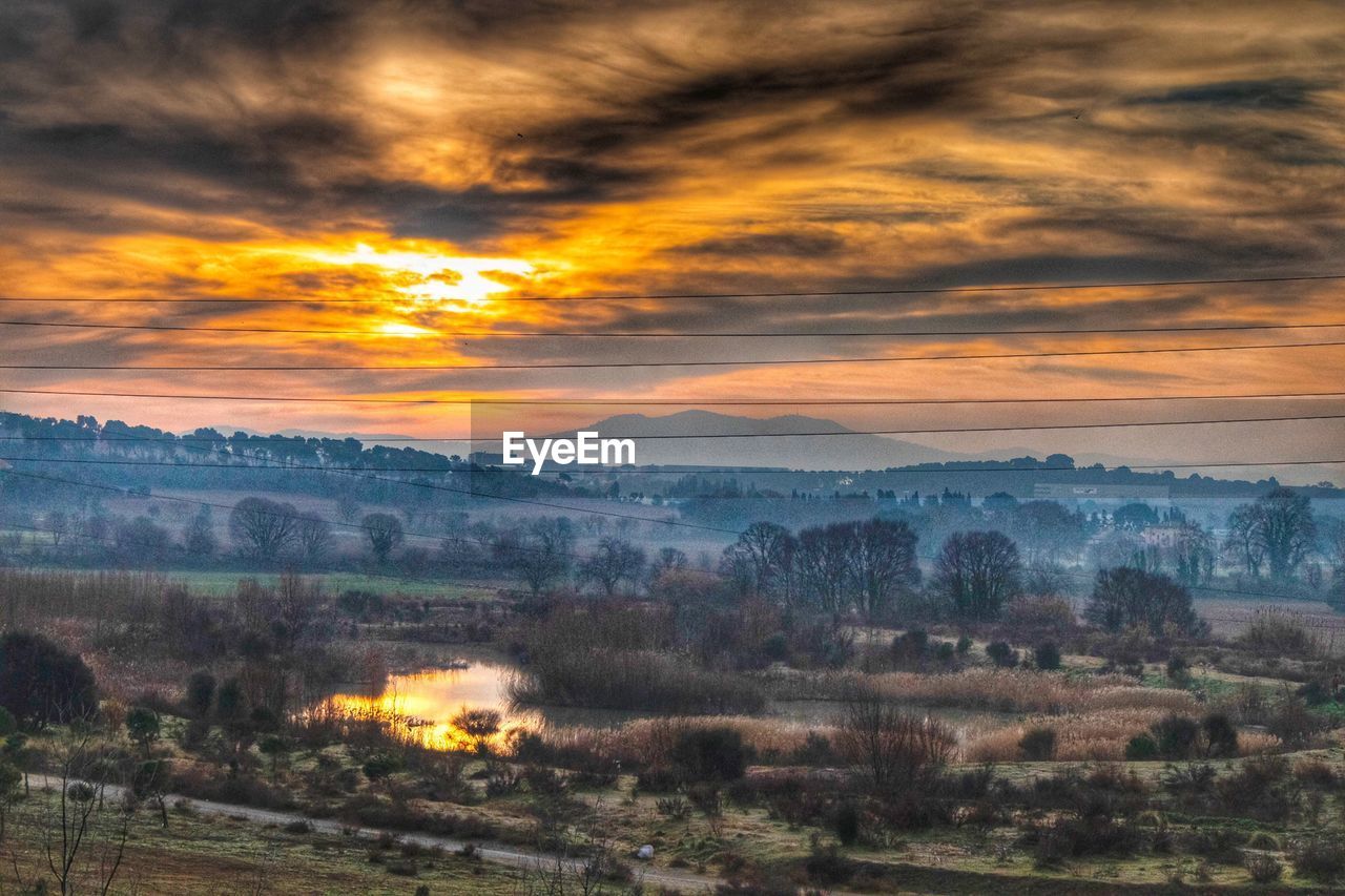 SCENIC VIEW OF DRAMATIC SKY OVER LAND