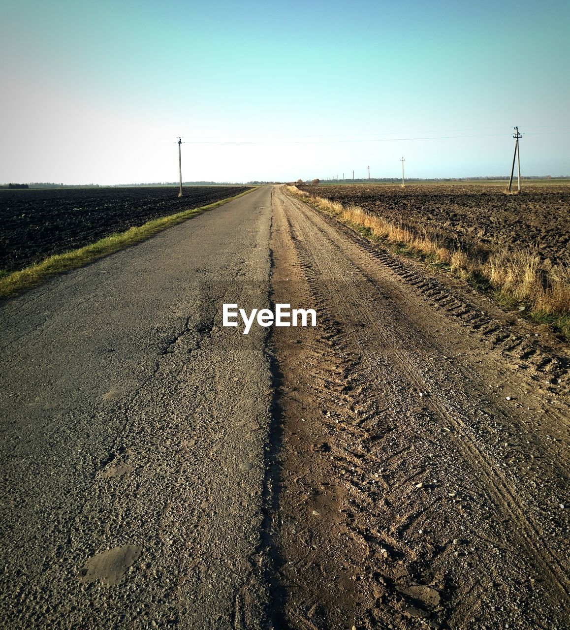 Empty road against clear sky