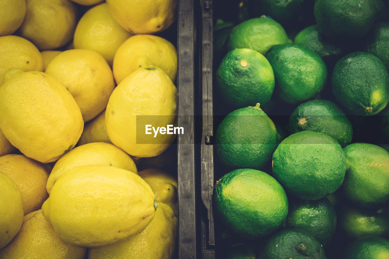 Full frame shot of fresh lemons for sale in market