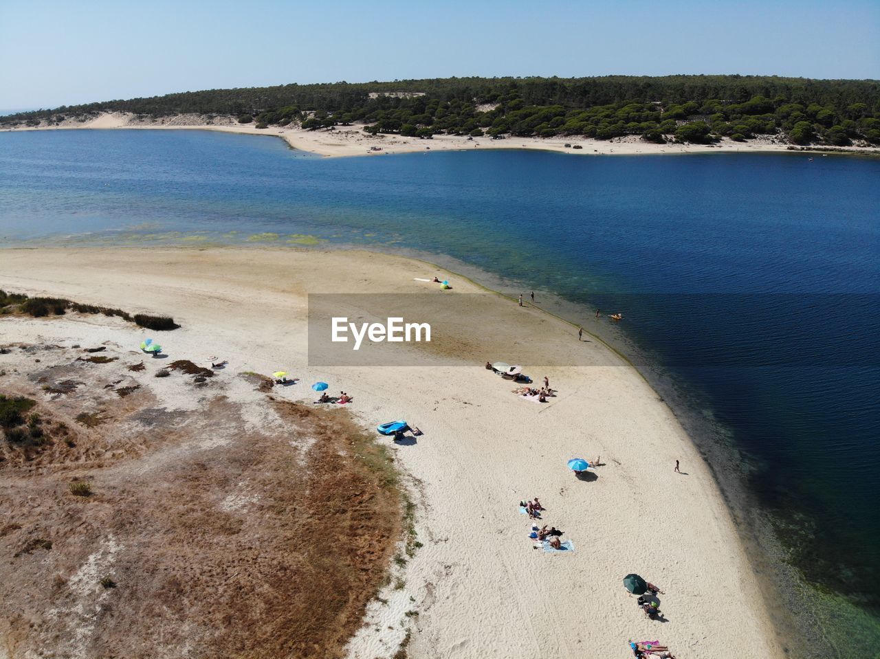 HIGH ANGLE VIEW OF PEOPLE ON SHORE AGAINST SKY