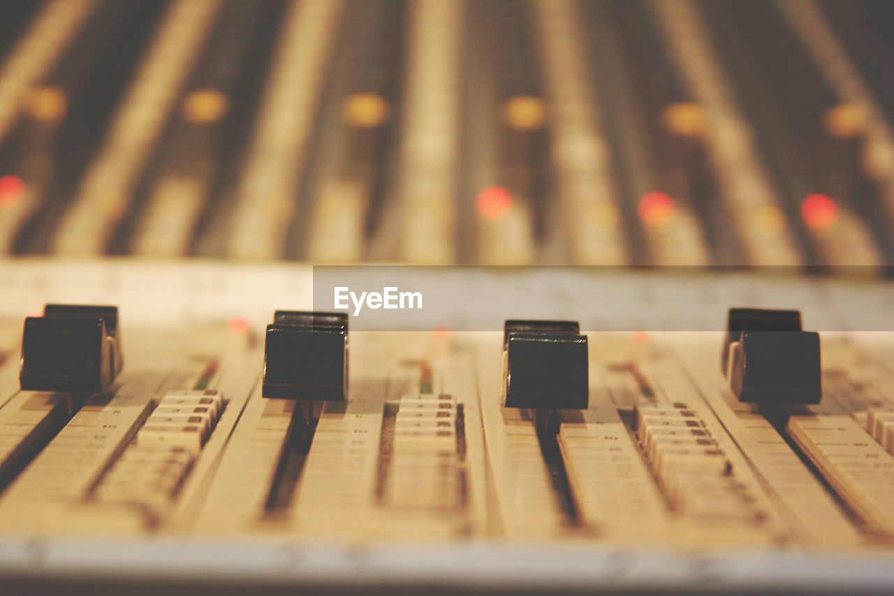 Close-up of sound mixer in recording studio