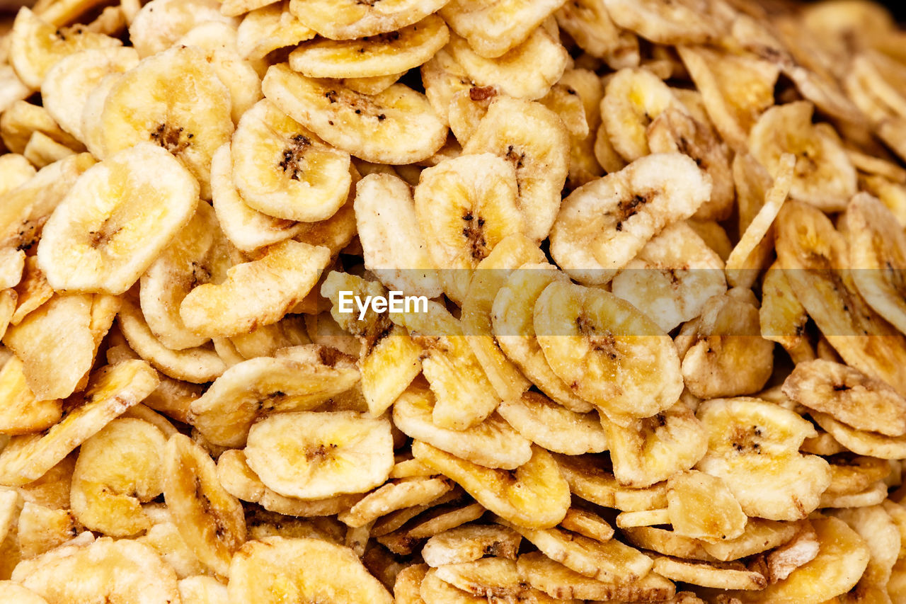 Dehydrated banana slices on a traditional craftsman image.