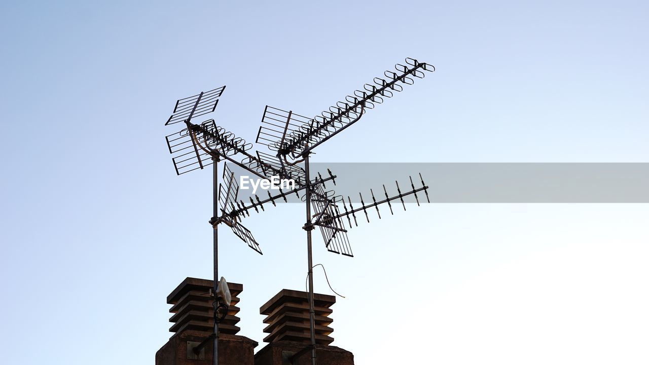 Low angle view of  tv pylon against clear sky