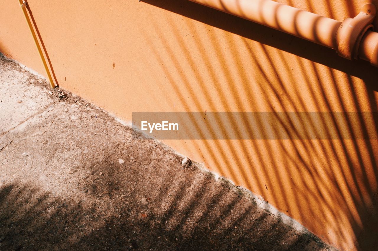 High angle view of shadow on wall and floor