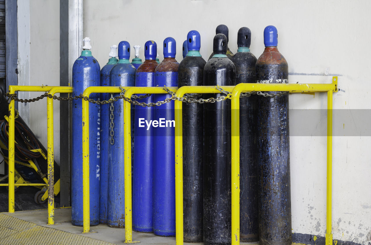 CLOSE-UP OF BLUE BOTTLES ON TABLE