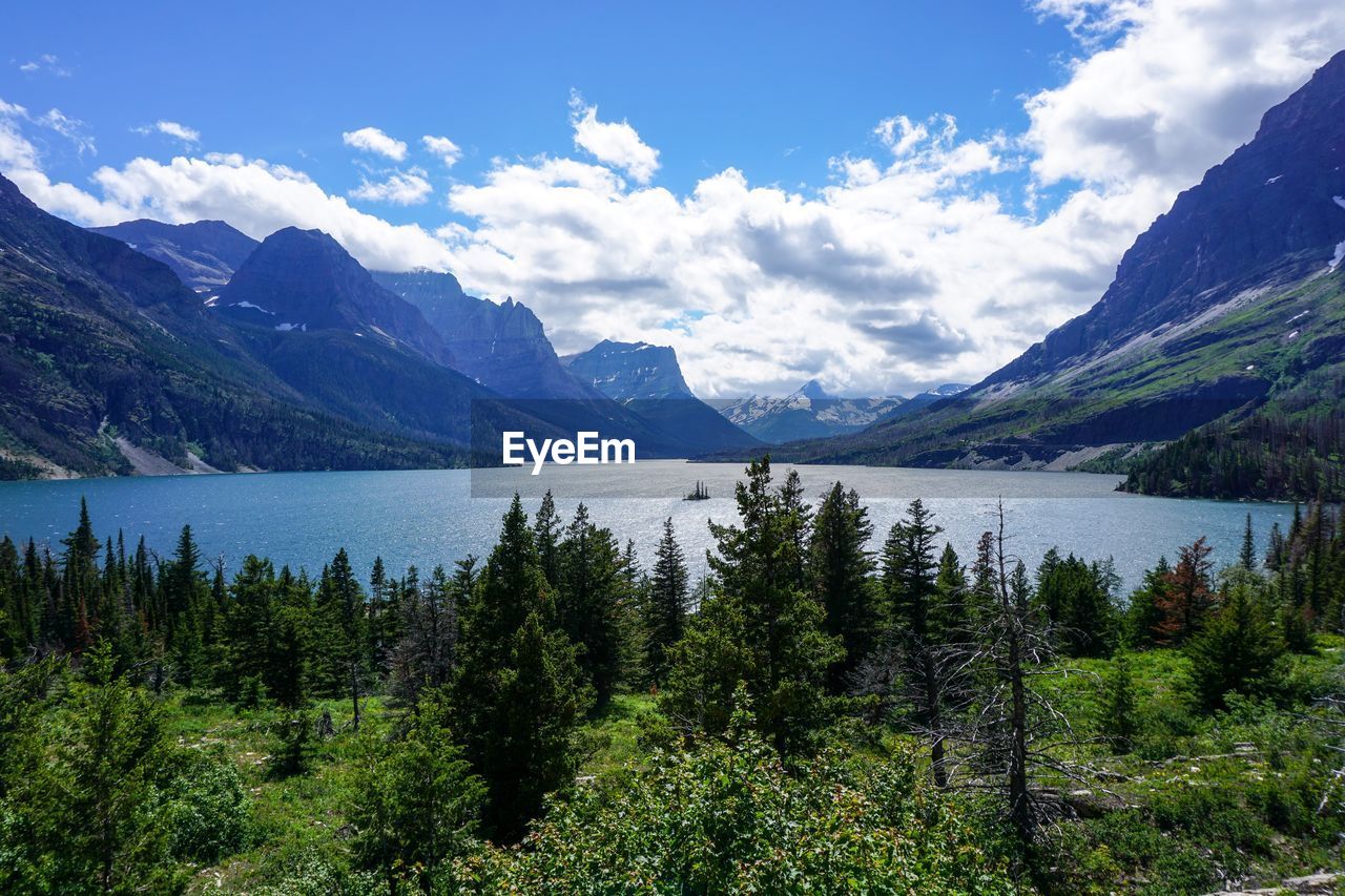 Scenic view of lake and mountains against sky