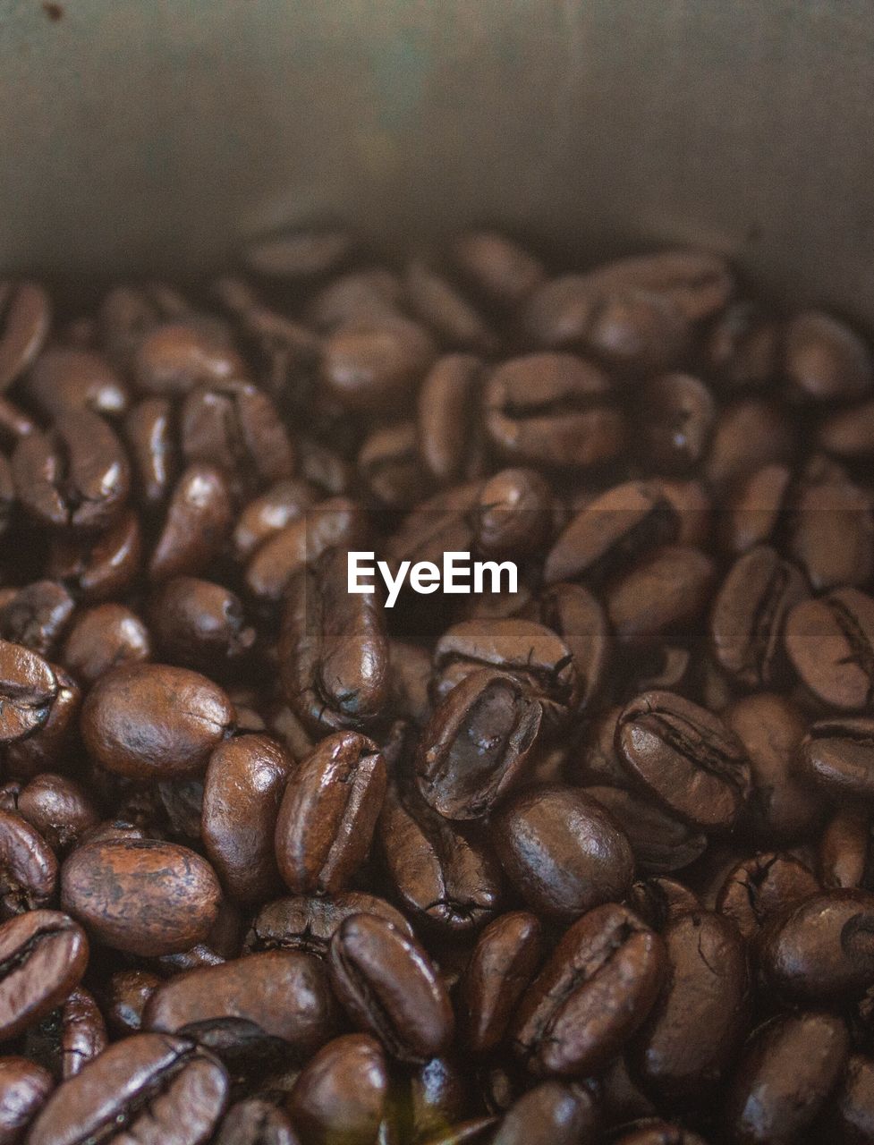 CLOSE-UP OF COFFEE BEANS IN GLASS