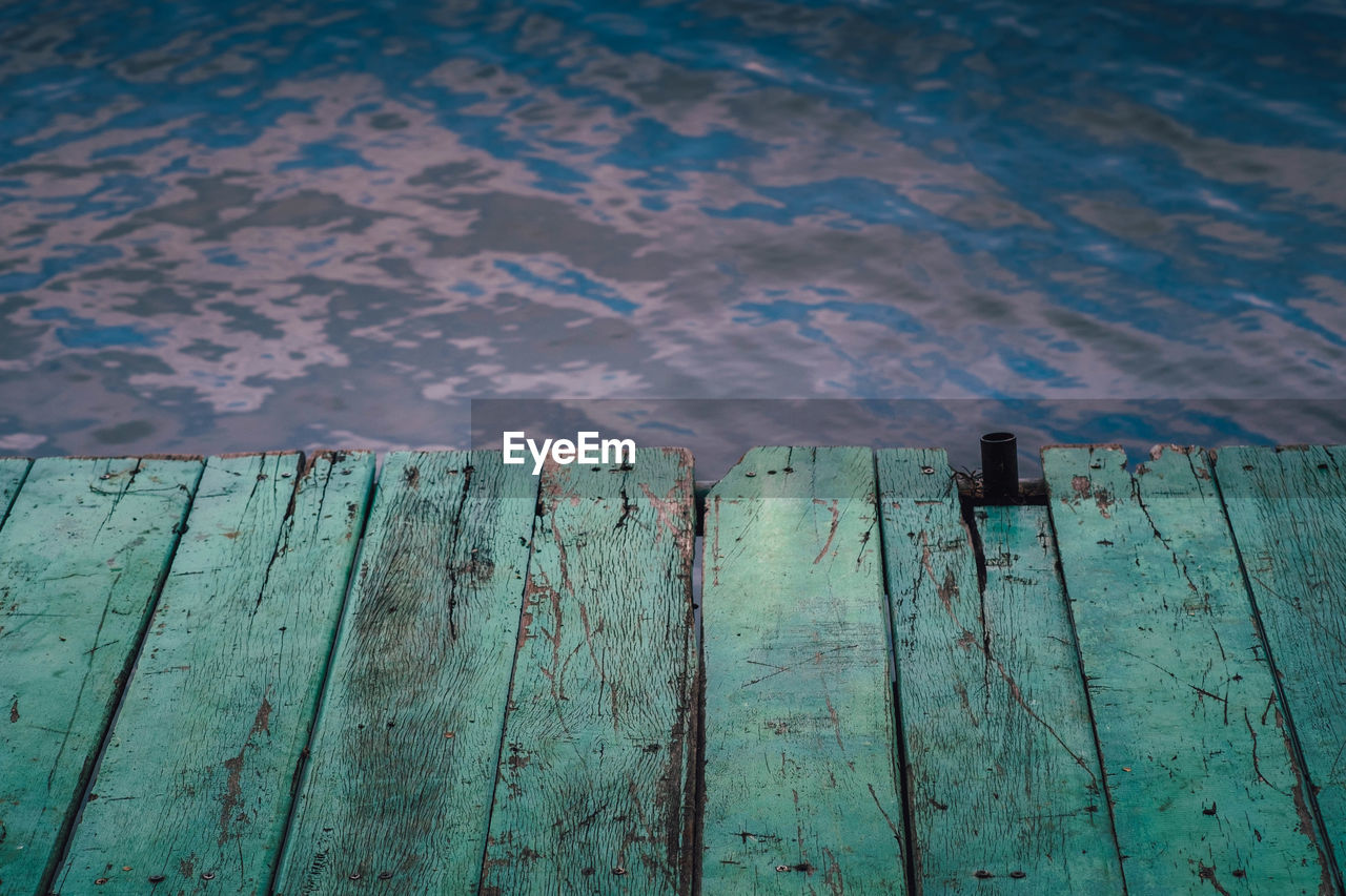 Close-up of wooden fence on pier