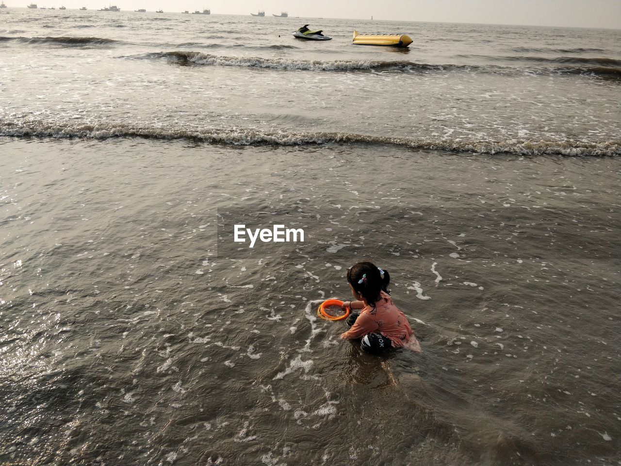 High angle view of girl swimming in sea