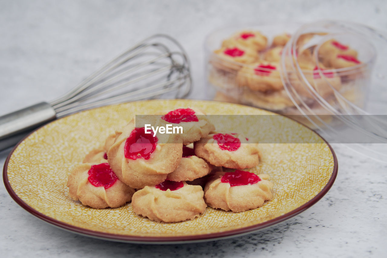 Malaysian kuih raya called strawberry butter cookies. popular kuih raya on hari raya aidilfitri.