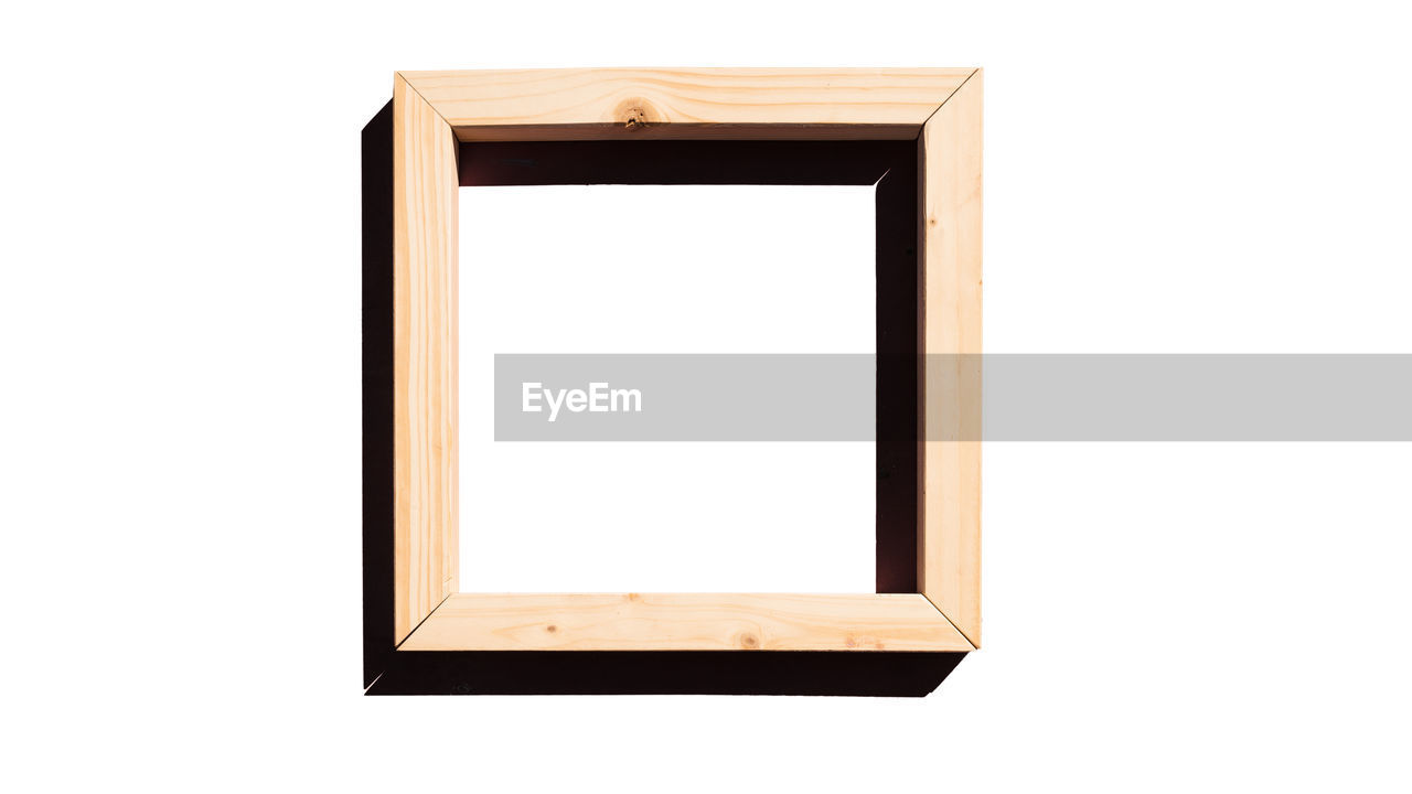 Empty wooden frame against white background